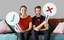 cheerful-couple-holding-vote-icon-sitting-couch.jpg